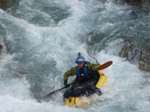 Photo of Shane (the author) packrafting, South Island, New Zealand; Alpacka Raft Calendar December 2014
